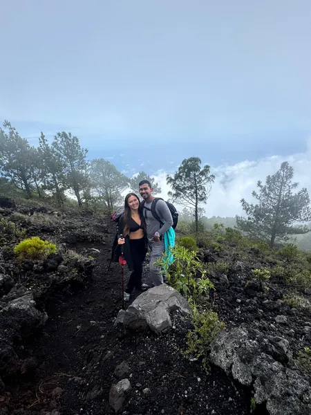 Rousse and Kaleb from Tours Alegría on a volcanic trail above the clouds